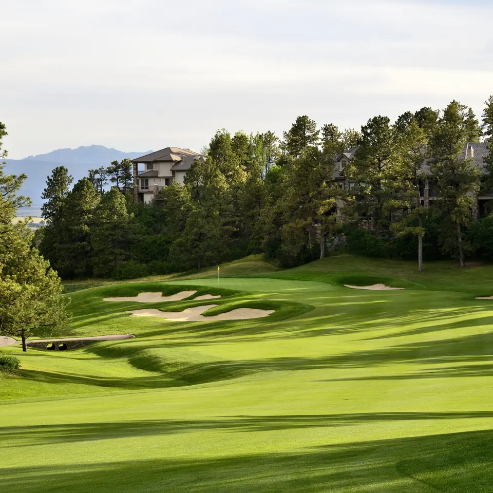 A pine-lined fairway at Castle Pines