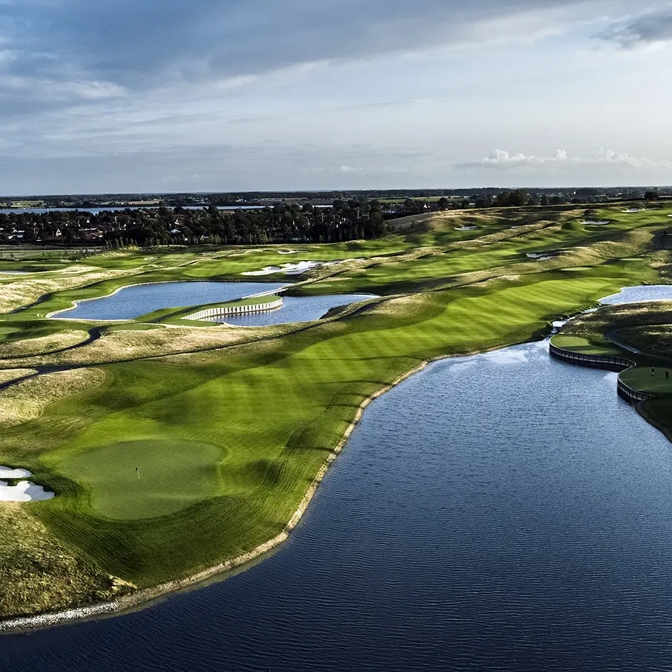 Aerial view of Great Northern, fairways curving around water