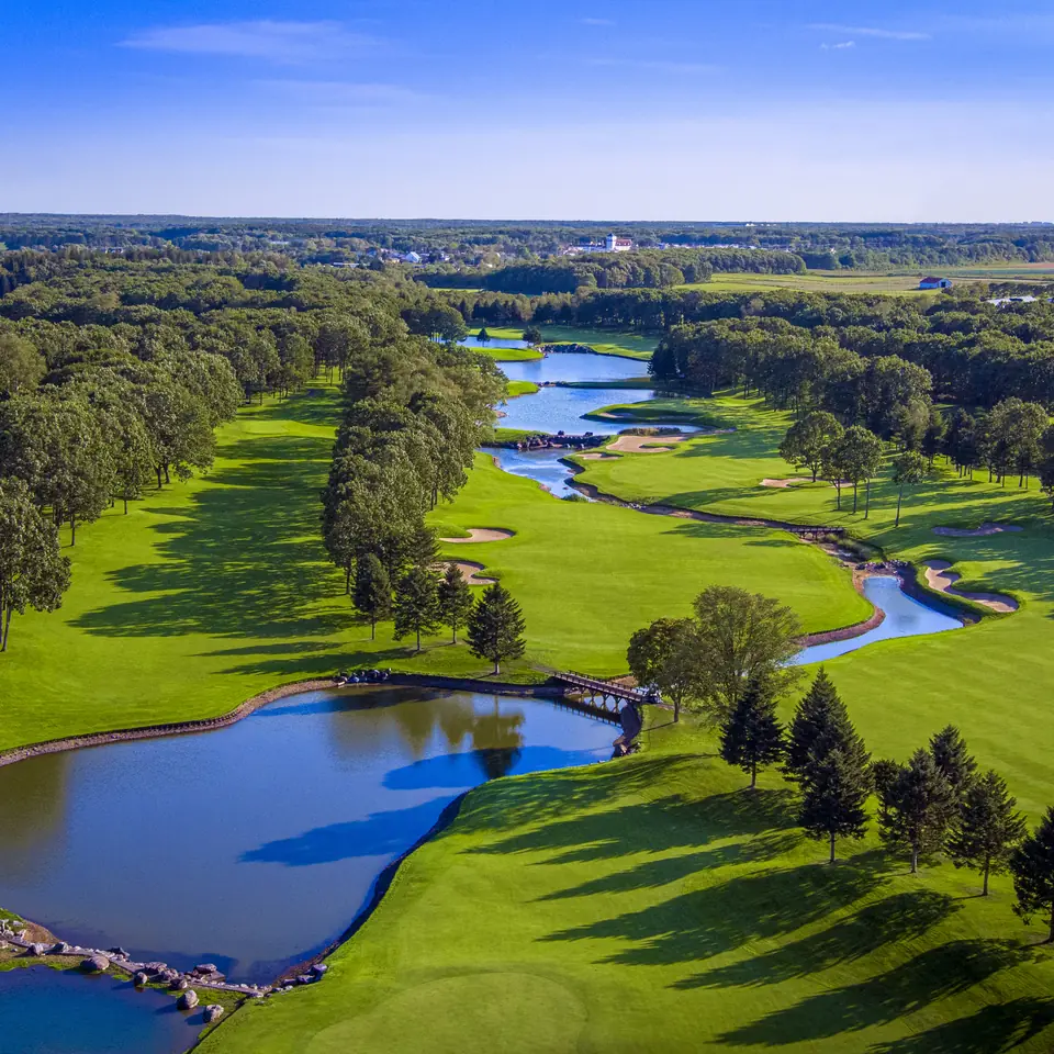 Aerial view of Hokkaido Classic, fairways threading lakes and forest