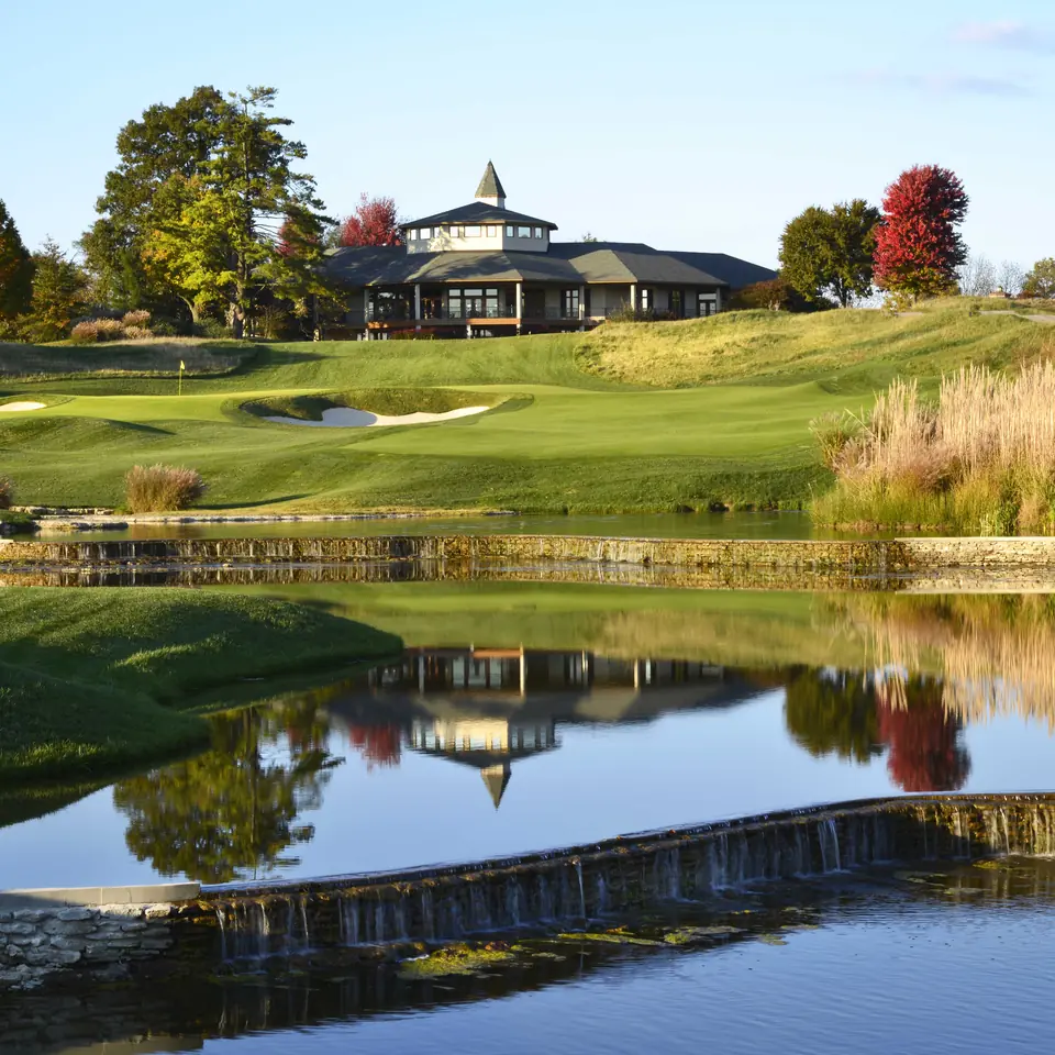 The 18th at Valhalla with the clubhouse beyond the water