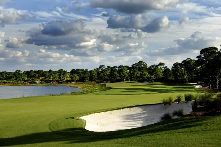 Steep, flashed bunkers at The Bear’s Club beneath a bright sky