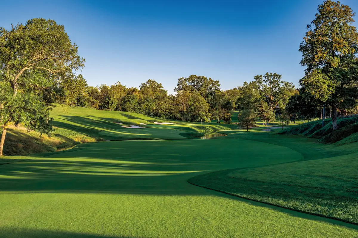 The 14th green at Muirfield Village, set beside the creek