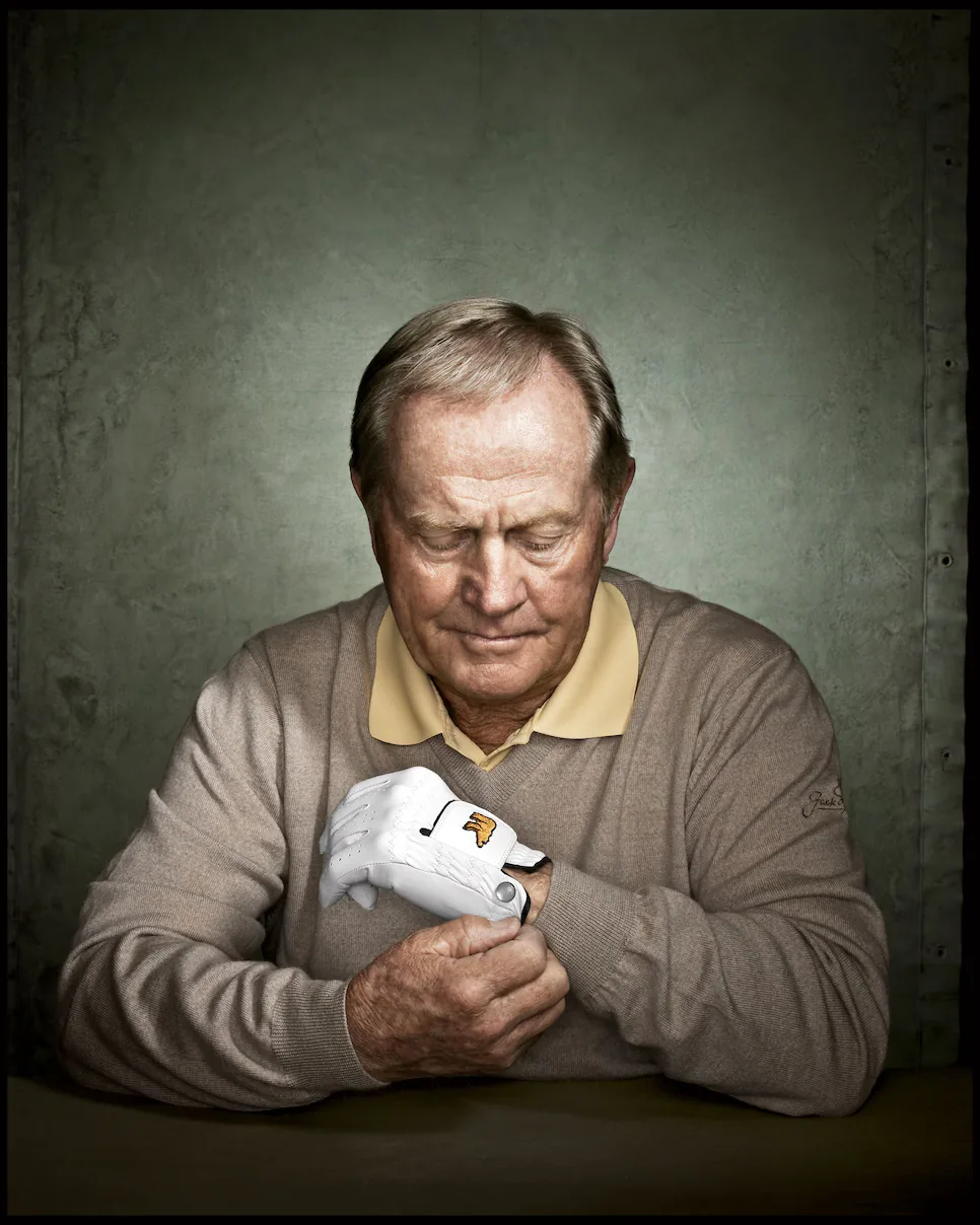 Jack Nicklaus pulling on a golf glove, his gold Rolex on his wrist